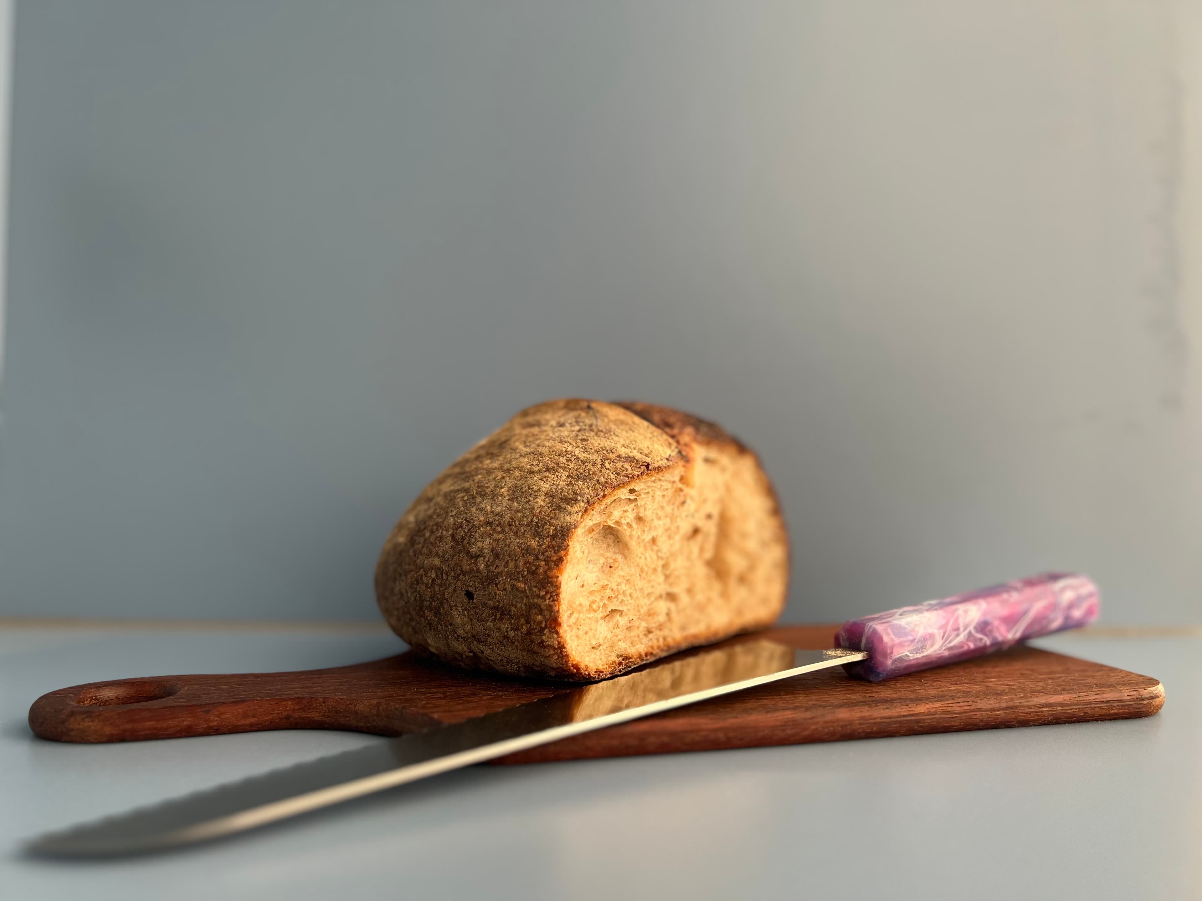 Still life detail with bread and utensils in the City Rd Flat
