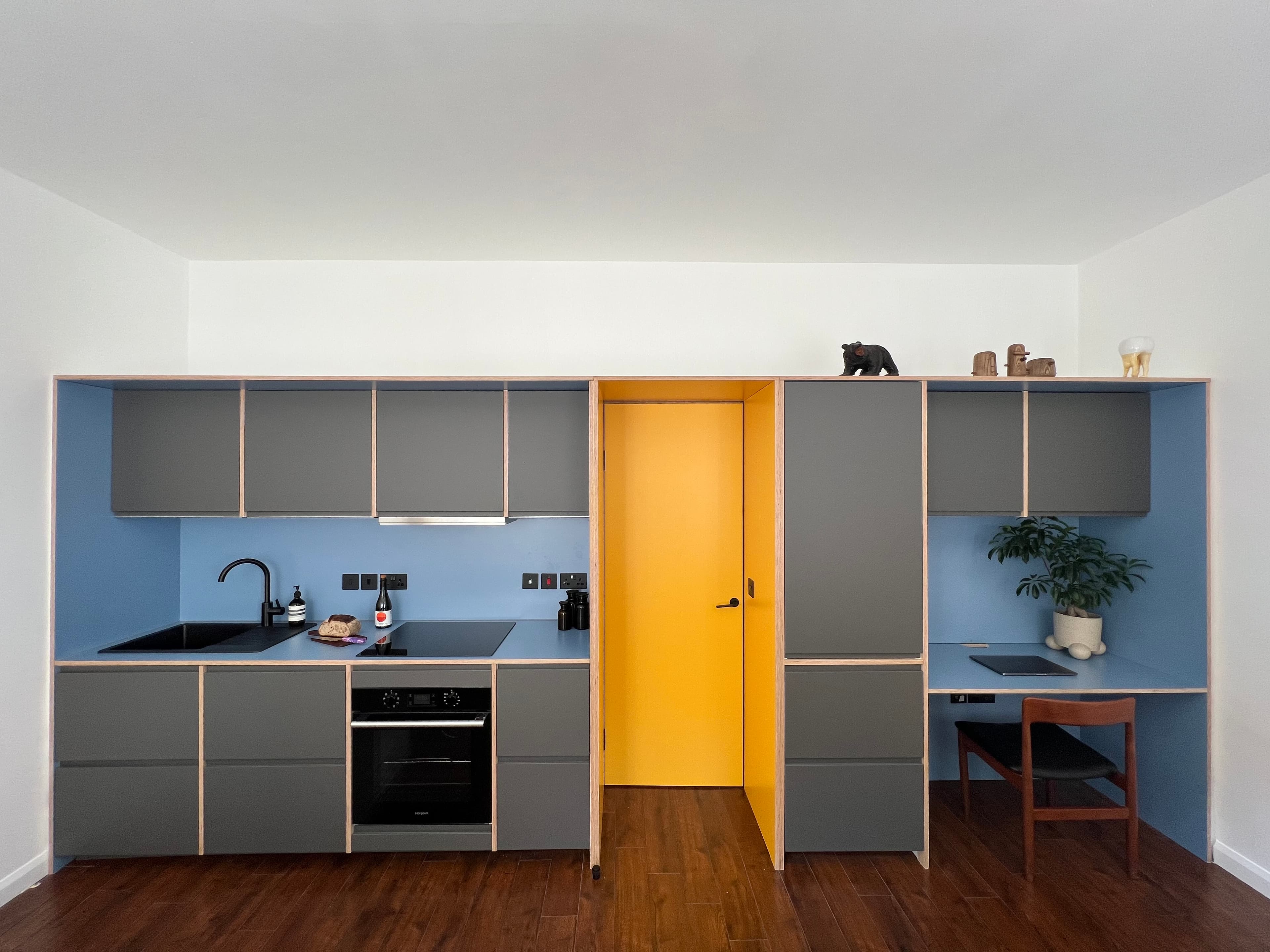 Full view of the bespoke kitchen and integrated workspace