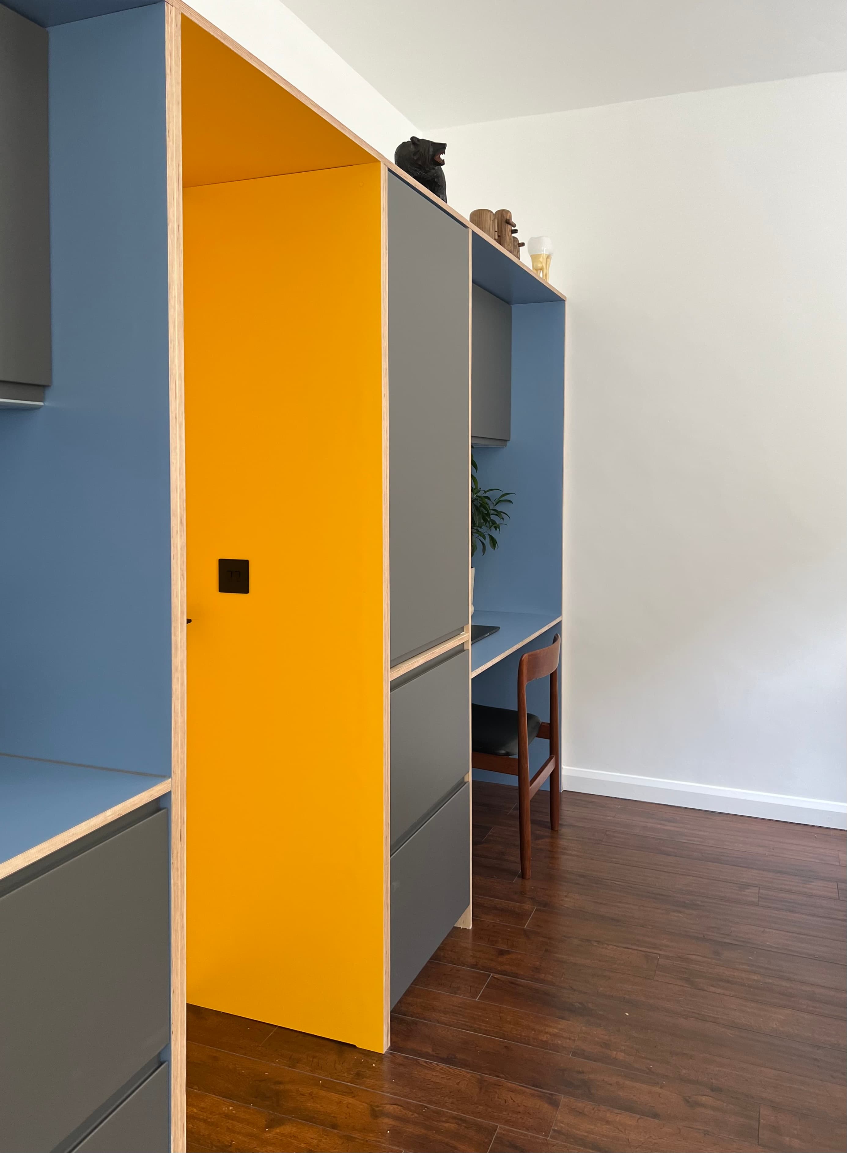 Yellow door and kitchen joinery detail