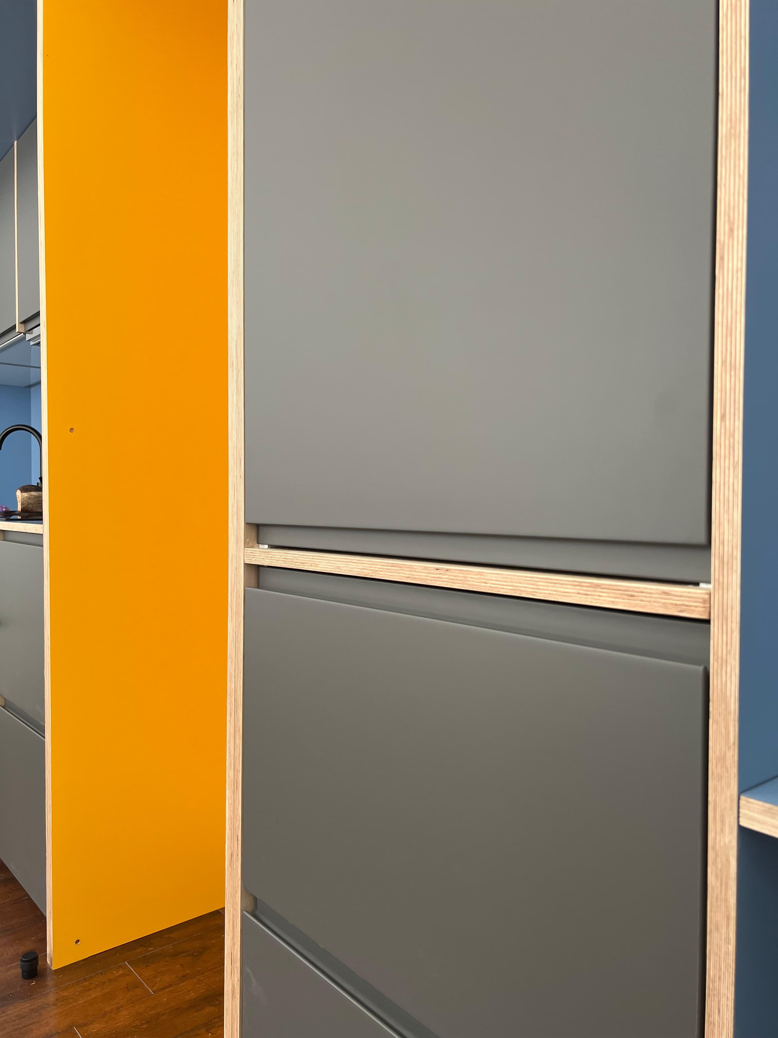 Overhead view of grey and yellow bespoke joinery